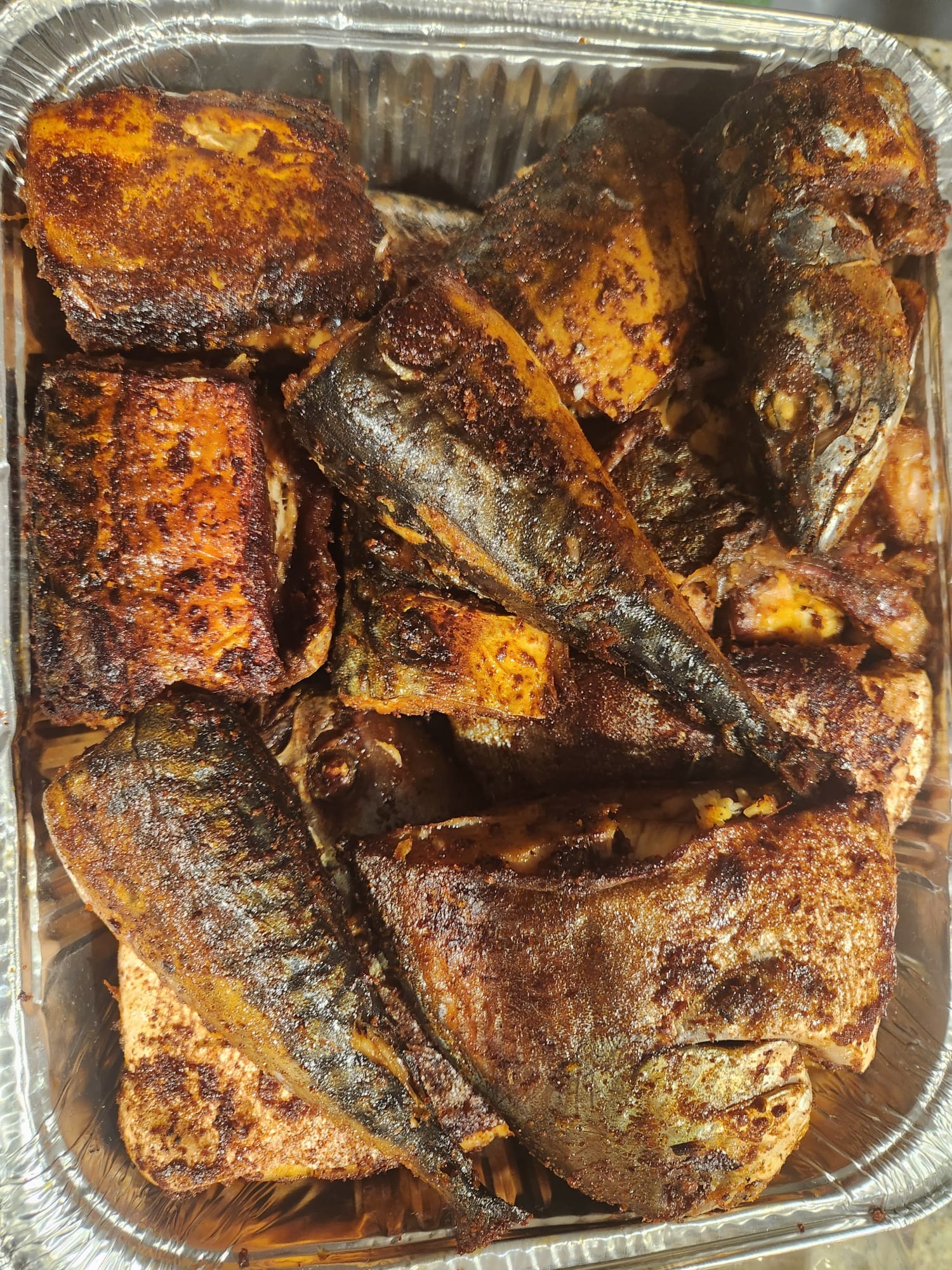 Seasoned whole fish cooked until golden