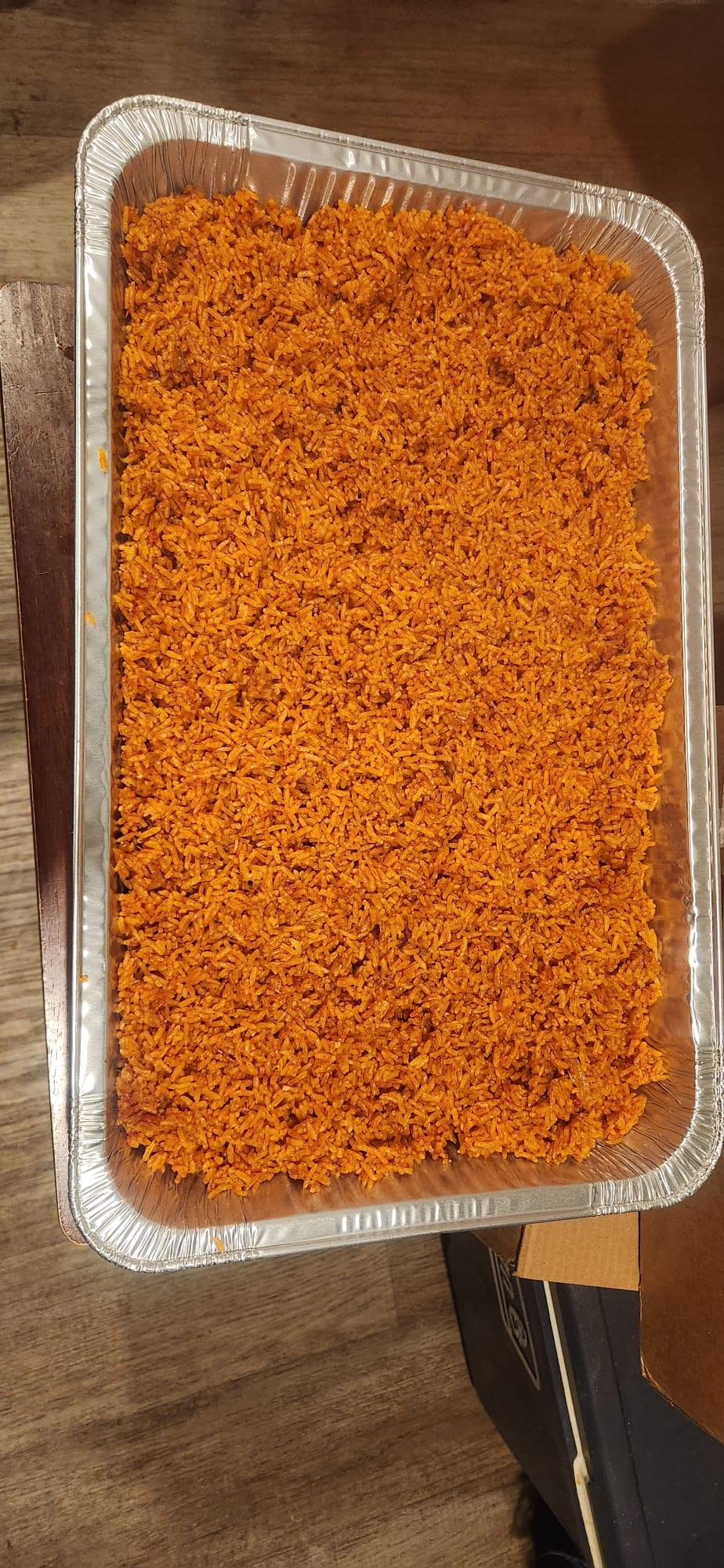 A full tray of orange jollof rice